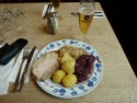 Pork roast, potatoes, saurkraut, and beer